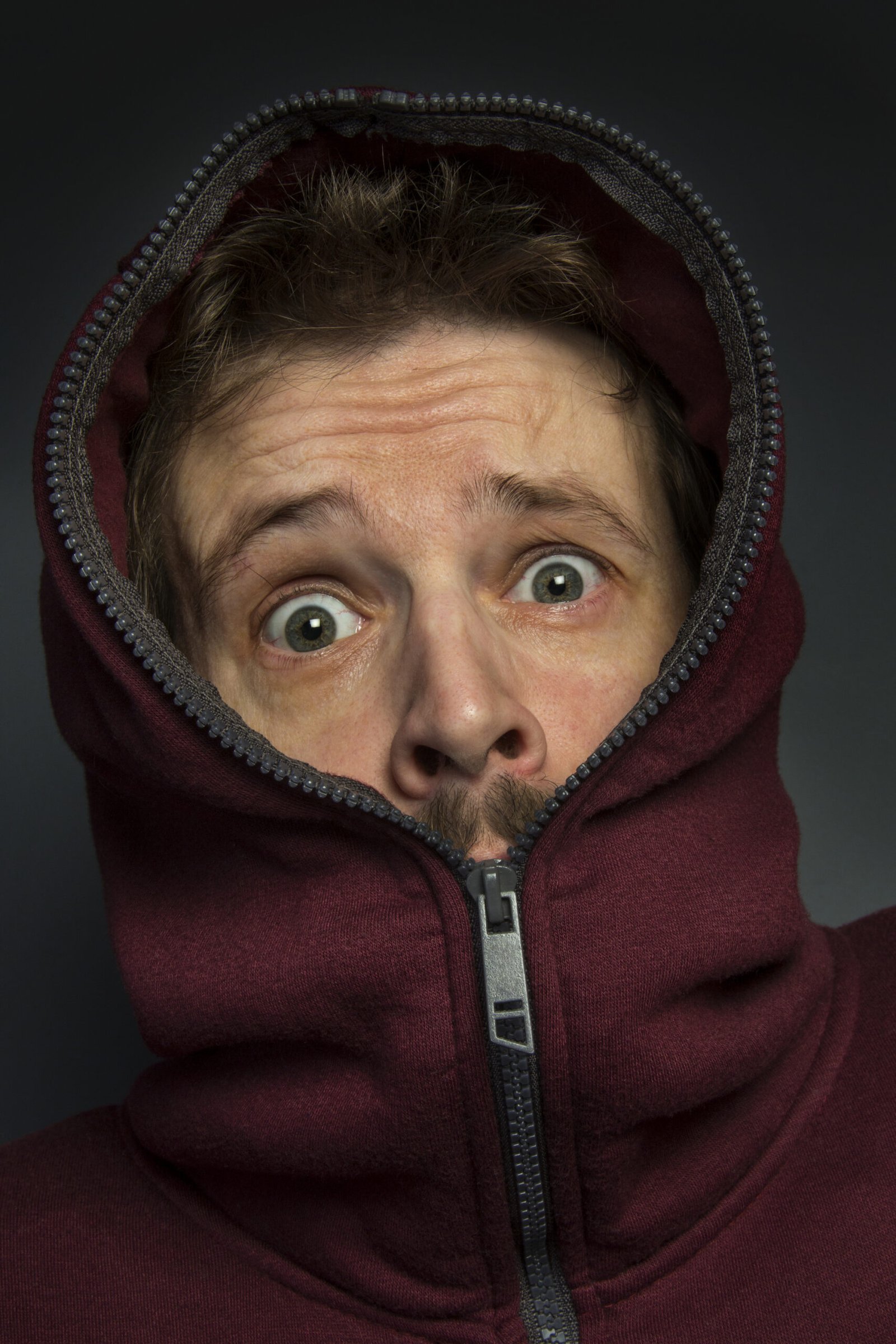 Fear - Surprise Man in hoody with a look of fear and surprise on his face.